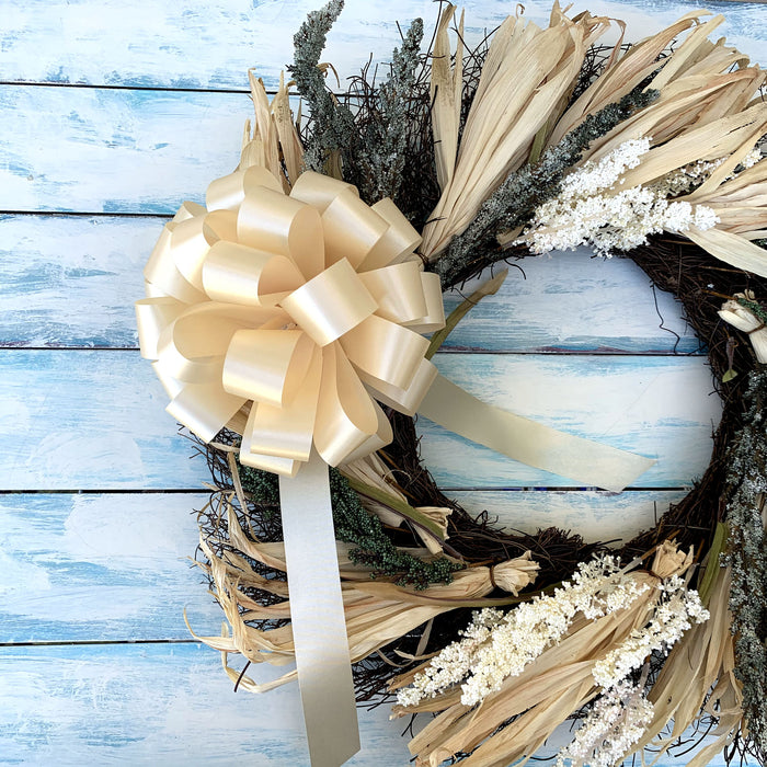 champagne color bows on a fall and harvest wreath