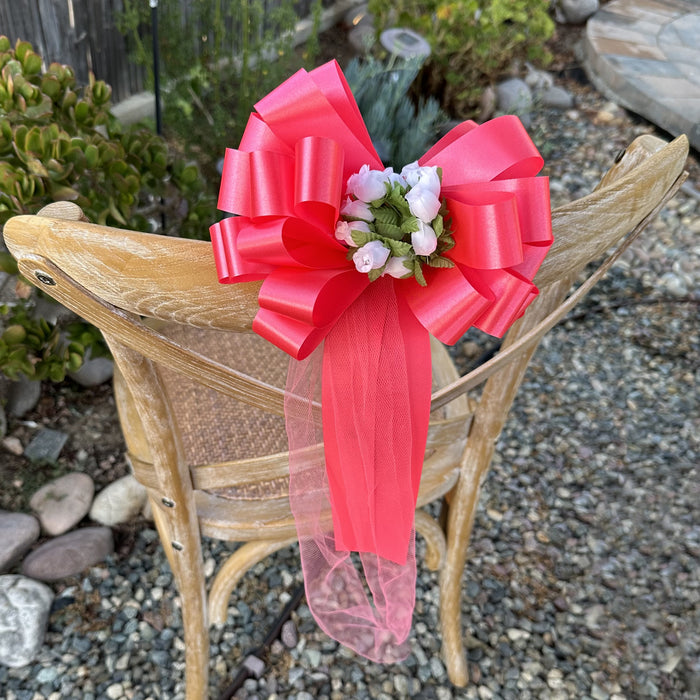 coral-bows-with-tulle-tails-and-white-rosebuds