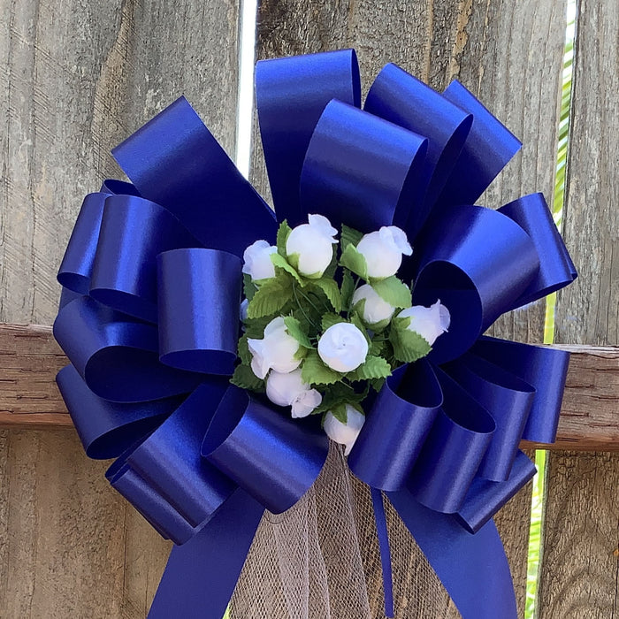 white-rosebuds-and-tulle-tails-on-royal-blue-bows