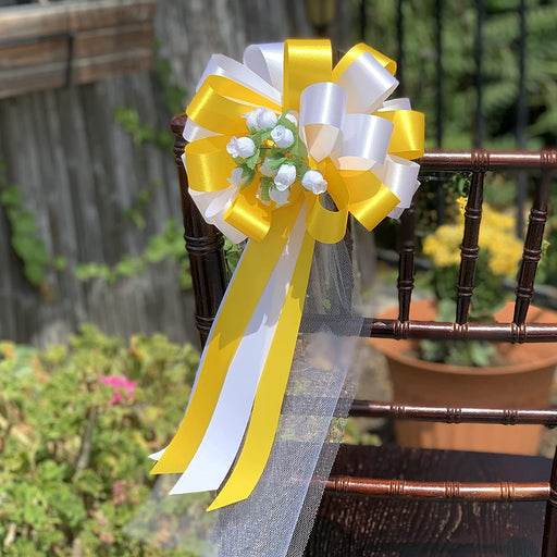 yellow-white-pull-bows-with-rosebuds-and-tulle-tails